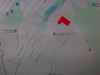 Земельна ділянка 0,1 га в м.Олександрія з літньою кухнею та гаражем.