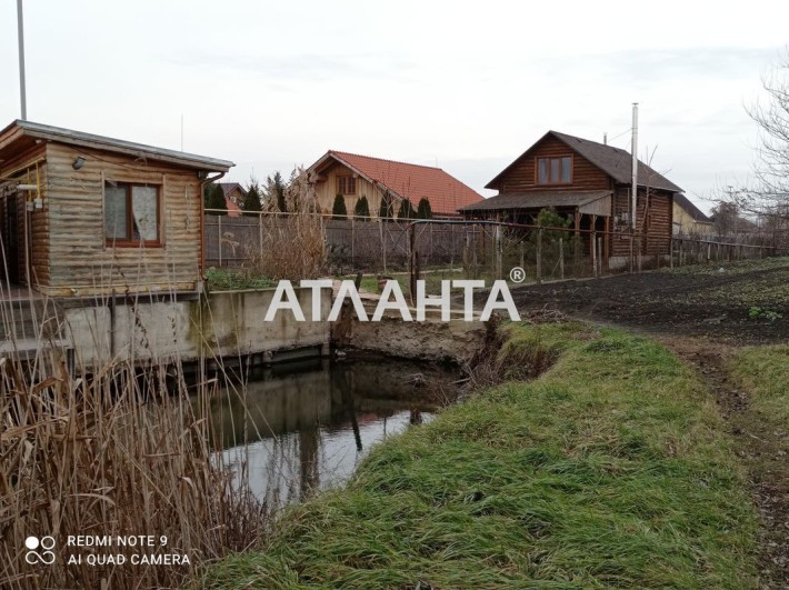 Сруб в центре города Беляевка с выходом в реку Турунчук (через канал) - фото 1