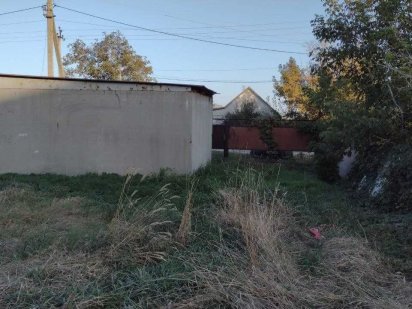 Продам гараж  и землю в центре  Партизанского Партизанское