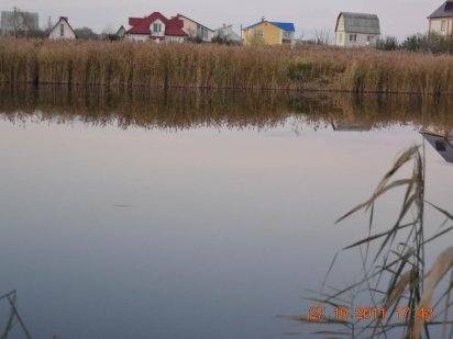 ищу обмен моего участка 2,5 га с озерами на готовый коттедж под Киевом