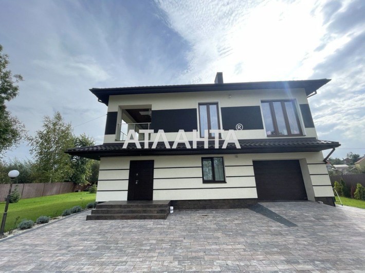 Будинок з дизайнерським ремонтом та прибудинковою територією - фото 1