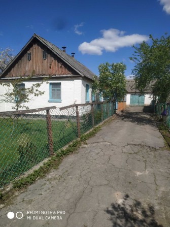 С.Барвинівка.Продам дерев'яний будинок обкладений цеглою - фото 1