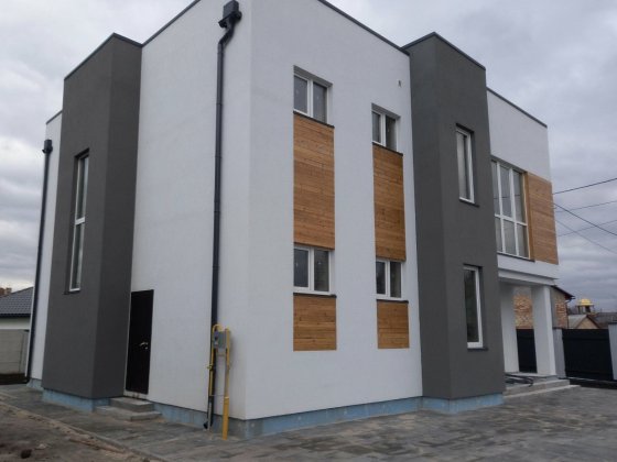 Новий двохповерховий котедж в Козині Козин