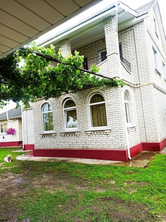 Двопорховий будинок та земельна ділянка - фото 1