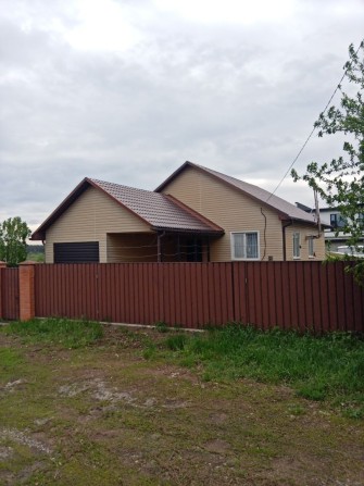 Будинок за таращянським масивом летра на березі річки - фото 1