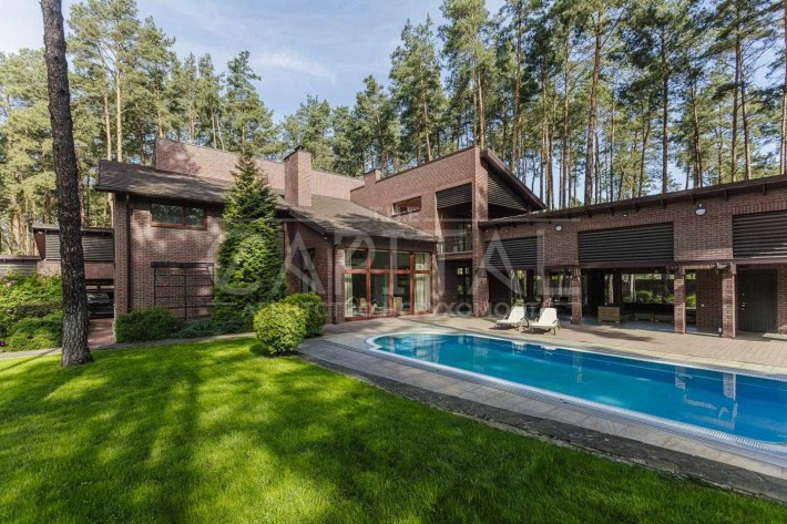 Продам дизайнерский дом в 500м2 в Буче. Ирпень. Закрытый КГ. Бассейн. - фото 1