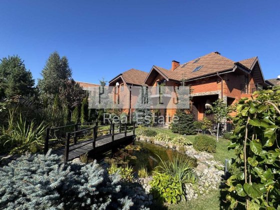 Продаж нового ексклюзивного будинку з озером в Козині 12 соток 420м2 Козин