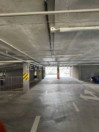 Продаж критого паркомісця В ЖК Варшавський, вул. О.Олеся 25 - фото 1