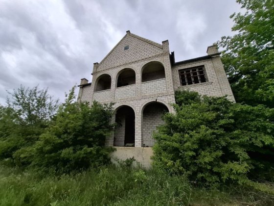 Двухэтажный дом с монсардой и гаражем внутри Подільськ