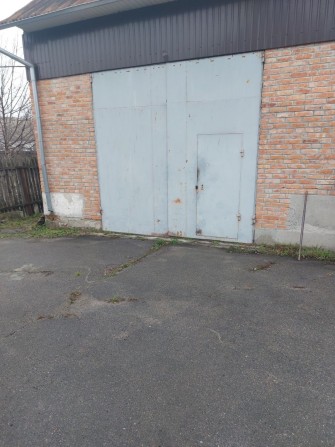 Гараж по вул.Полтавська, загороджена територія, асфальтований під'їзд. - фото 1