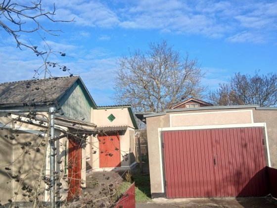 Продам частину будинку з гаражем Шепетівка