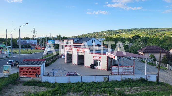 Земельна ділянка 26 соток з СТО, мийкою та готелем - фото 1