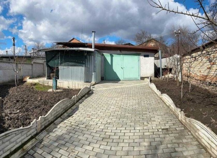 Продам участок земли с гаражом на 2 машины и смотровой ямой - фото 1