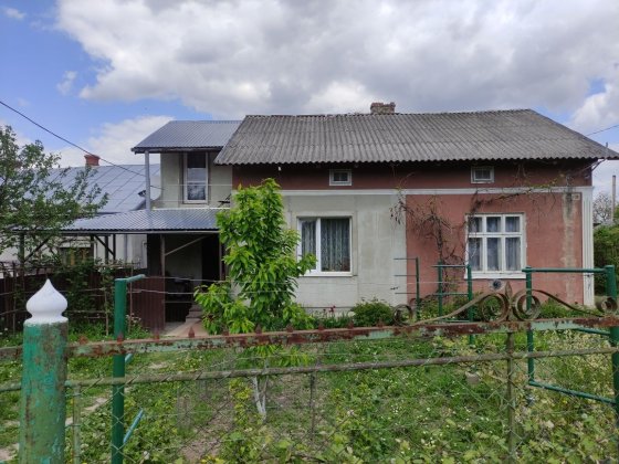 Продаю половину Будинку,цегл гараж та прибуд зем ділянку пл 0.0412Га Дрогобич