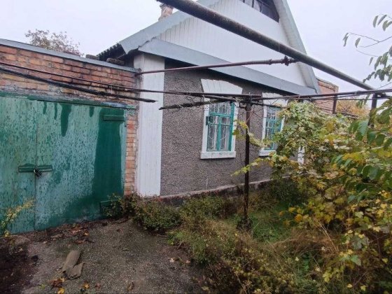 Дом с участком и гаражом центр, р-н ул. Мира Марганец