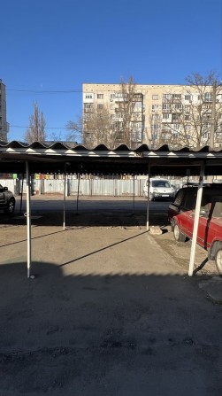 Продам крытое паркоместо на стоянке парковка  Искра 2 - фото 1