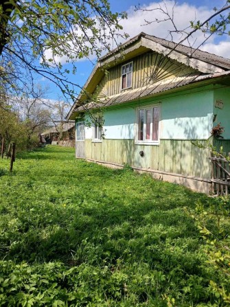 деревяний будинок із земельною ділянкою - фото 1