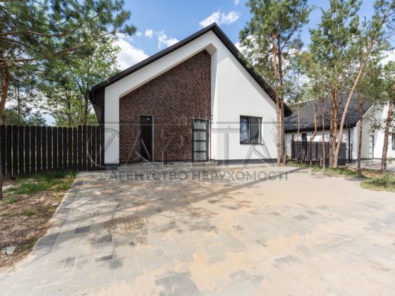 Продаж будинку з ремонтом ділянка 7 соток в КМ Woodcountry Путрівка Фастівський район