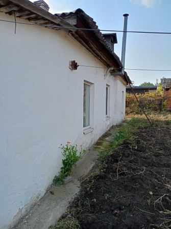 Продаж половини будинку в центрі міста Радомишль 100 км від Києва - фото 1