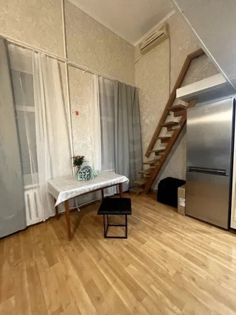 Простора двоповерхова квартира після ремонту - фото 1