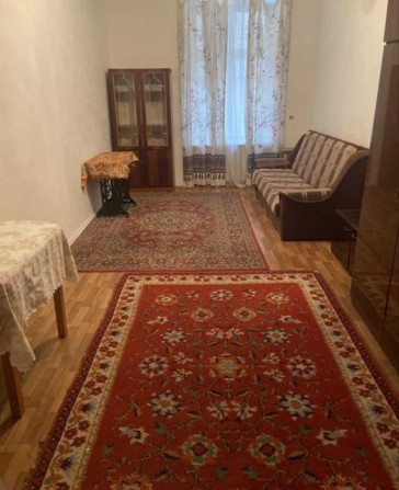 Продажа комнаты в коммуне в Центре - фото 1